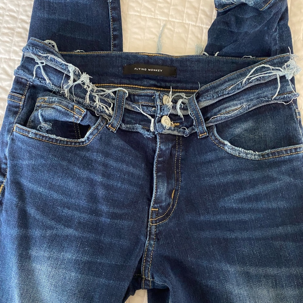 Women’s mid rise Flying Monkey skinny distressed jeans